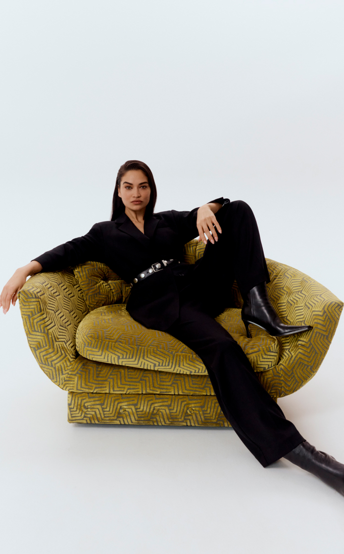 Shanina in black wool blend single-breasted boxy blazer, black wool blend relaxed rise trouser and black studded leather belt