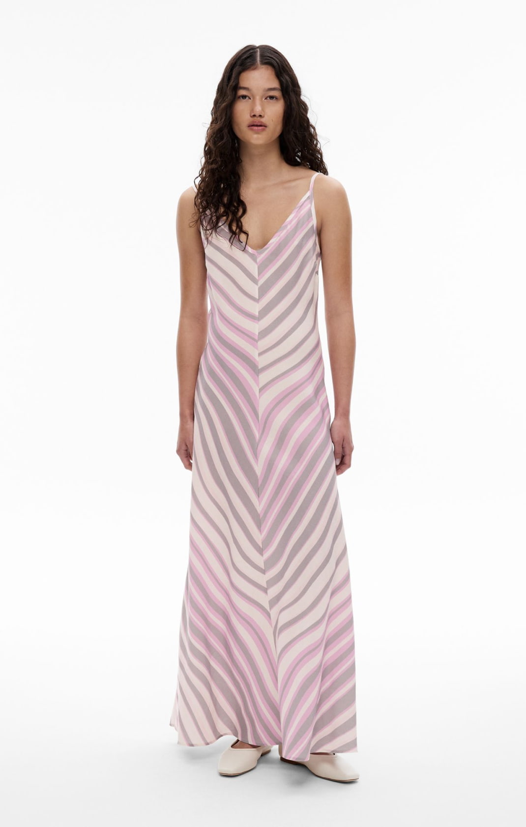 Woman wearing the maxi slip dress and alyssa ballet shoes