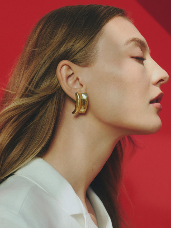 Woman wearing lucia clip on earring