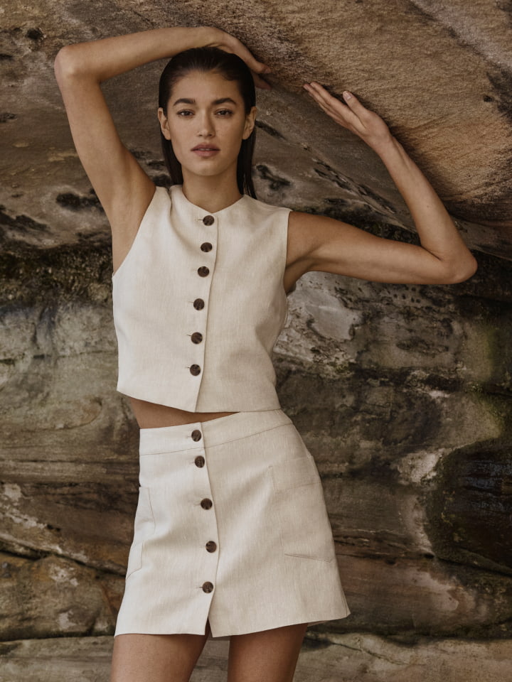 Woman in tuck detail mini dress and savannah heel