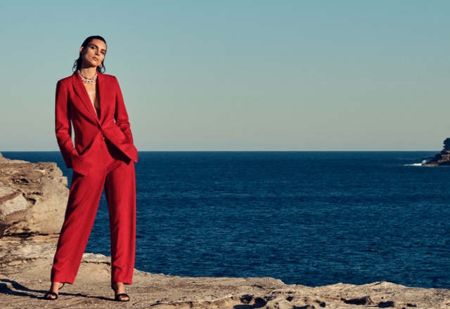 Model in womens red blazer and pants